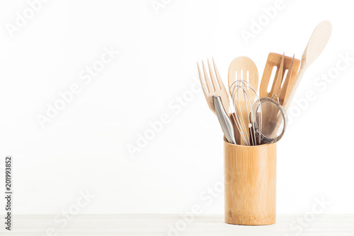 closeup view of sieve, whisk and kitchen utensils isolated on white background