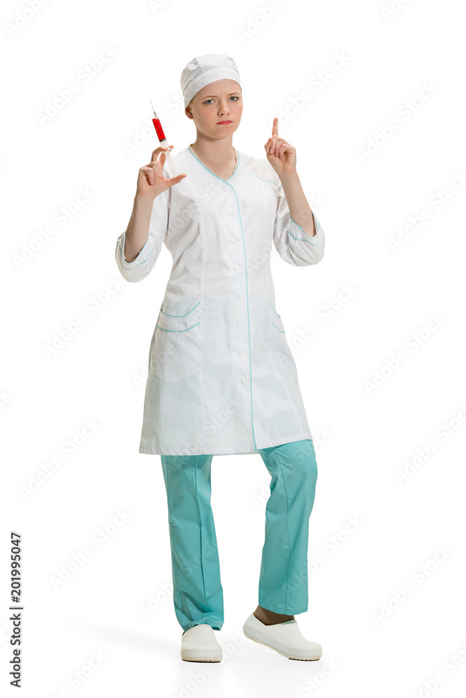 beautiful young woman doctor in medical robe holding syringe in hand. beautiful young woman doctor in medical robe holding syringe in hand.