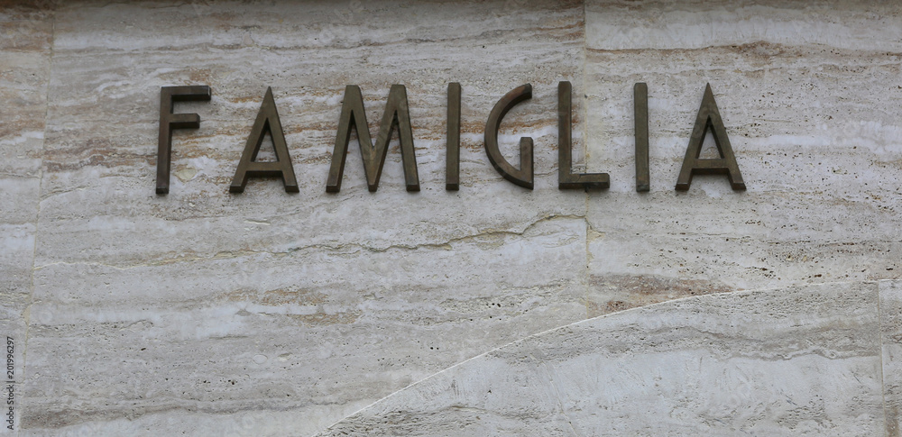 text FAMIGLIA that means famiyl in Italy Language