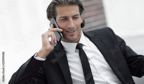 business man talking on smart phone.