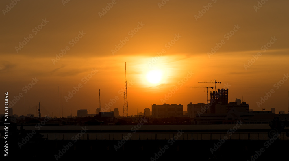 sunset time in metropolis urban cityscape with orange sky sunset time in metropolis urban cityscape with orange sky