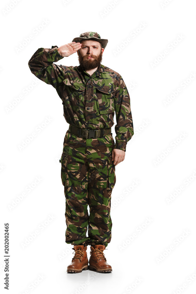 Young army soldier wearing camouflage uniform isolated on white Young army soldier wearing camouflage uniform isolated on white