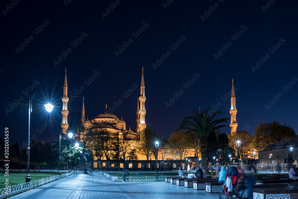 people sit in front of Sultanahmet Mosque