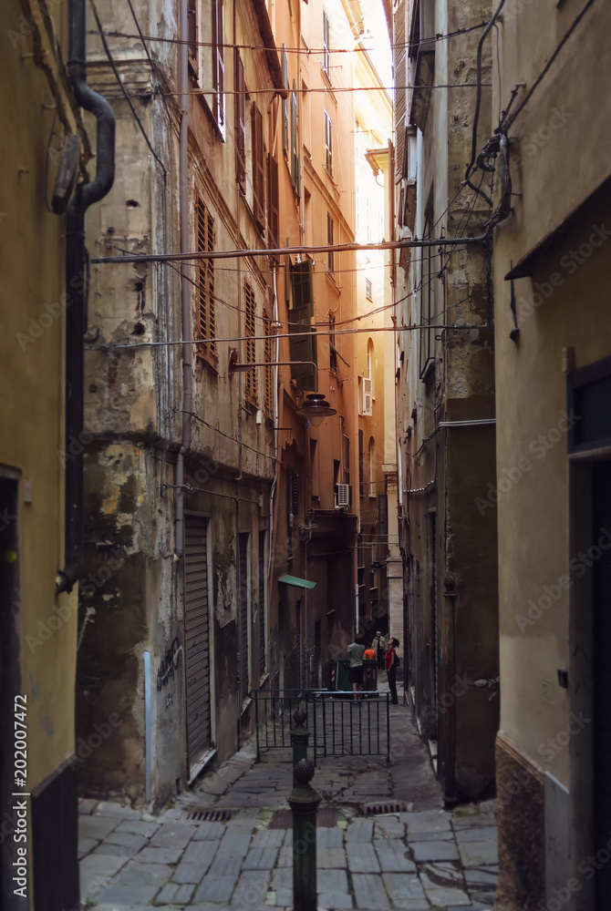 Narrow old and dark street in the Genoa Italy