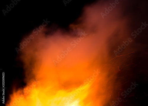 fire with smoke on a black background © schankz