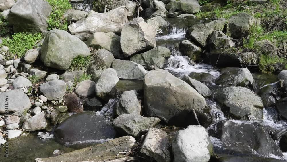 A small river finding its way thru rocks A small river finding its way thru rocks