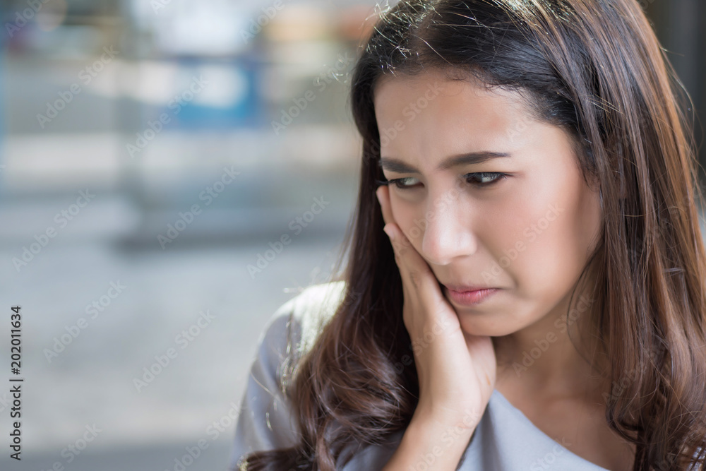 woman with toothache; portrait of woman suffering from toothache pain, tooth decay, tooth sensitivity; girl oral health care, dental care concept; asian young adult woman model woman with toothache; portrait of woman suffering from toothache pain, tooth decay, tooth sensitivity; girl oral health care, dental care concept; asian young adult woman model