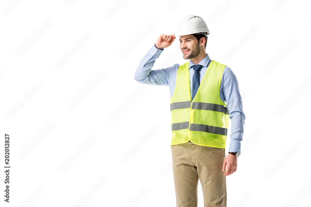 Smiling builder in reflective vest wearing helmet isolated on white Smiling builder in reflective vest wearing helmet isolated on white