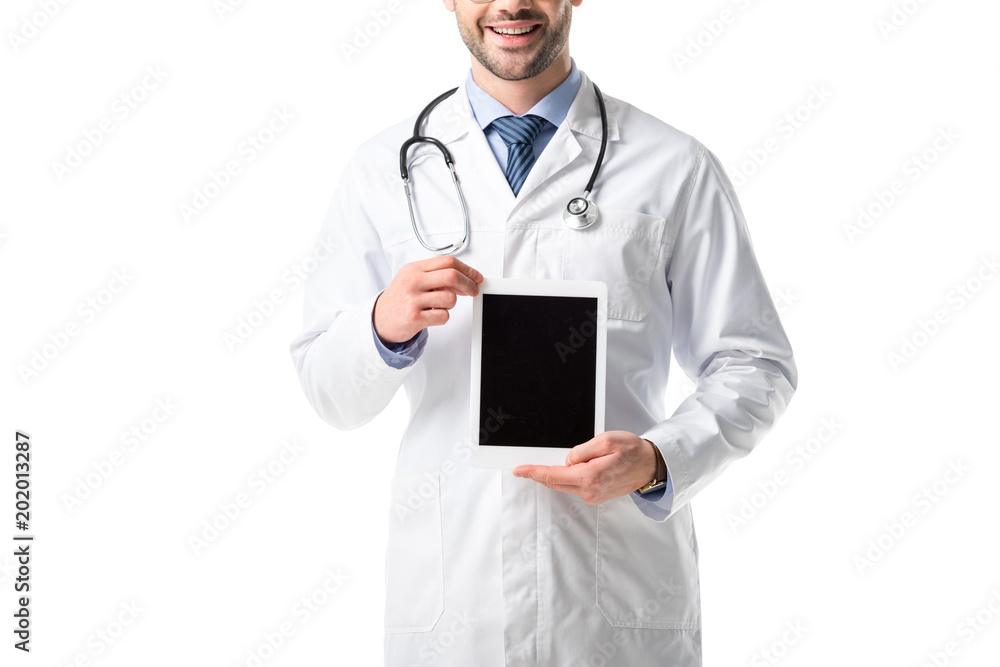 Close-up view of tablet with blank screen in hands of doctor wearing white coat with stethoscope isolated on white Close-up view of tablet with blank screen in hands of doctor wearing white coat with stethoscope isolated on white