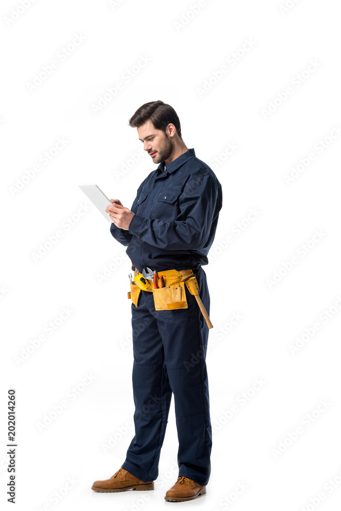 plumber in uniform using digital tablet isolated on white plumber in uniform using digital tablet isolated on white