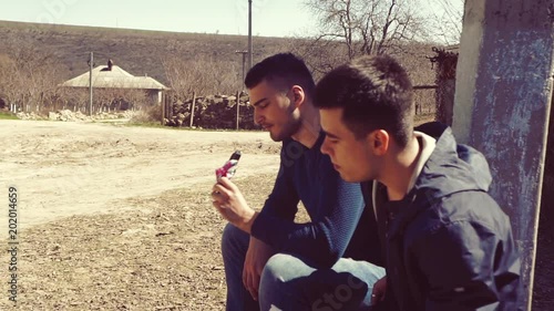 Two guys eat ice cream on the street photo