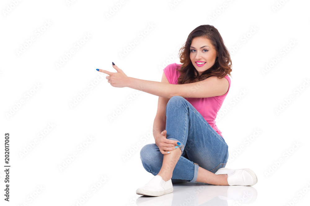 Smiling Woman Is Sitting On Floor Smiling And Pointing Smiling Woman Is Sitting On Floor Smiling And Pointing