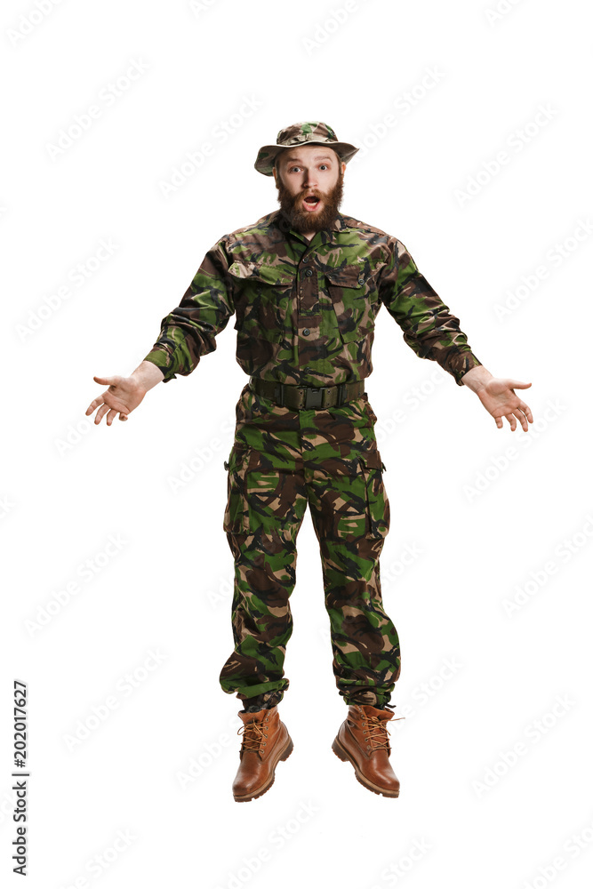 Young army soldier wearing camouflage uniform isolated on white Young army soldier wearing camouflage uniform isolated on white