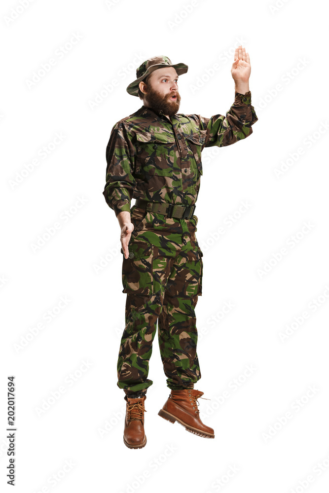 Young army soldier wearing camouflage uniform isolated on white Young army soldier wearing camouflage uniform isolated on white
