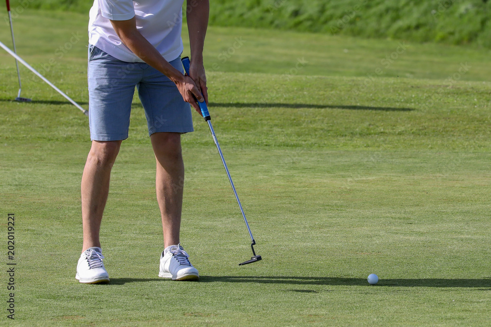 Fototapeta premium A golf player on a green