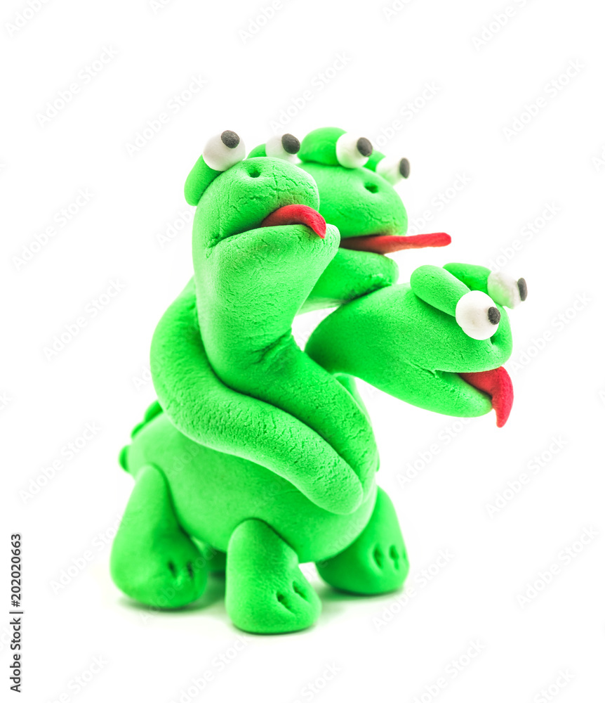 Fototapeta premium green hand made modeling clay dragon with three heads isolated on white