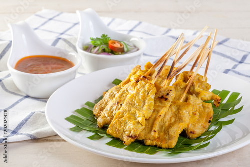 Grilled pork served with peanut sauce or sweet and sour sauce, Thai food