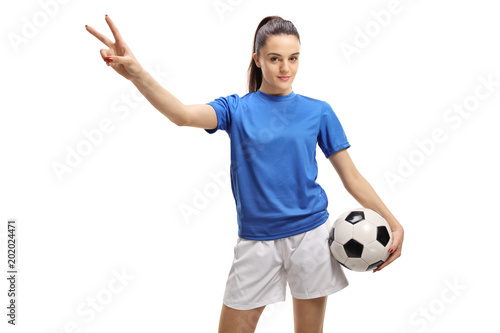 Female soccer player making a victory gesture