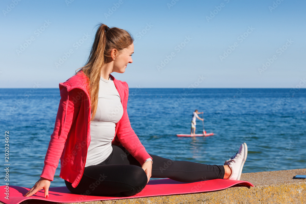 Fototapeta premium Woman resting relaxing after doing sports outdoors