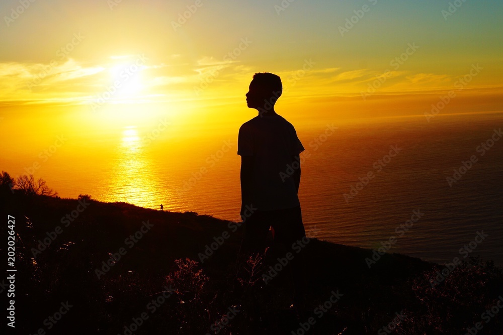 A boy's silhouette in Cape Town, South Africa in February 2018