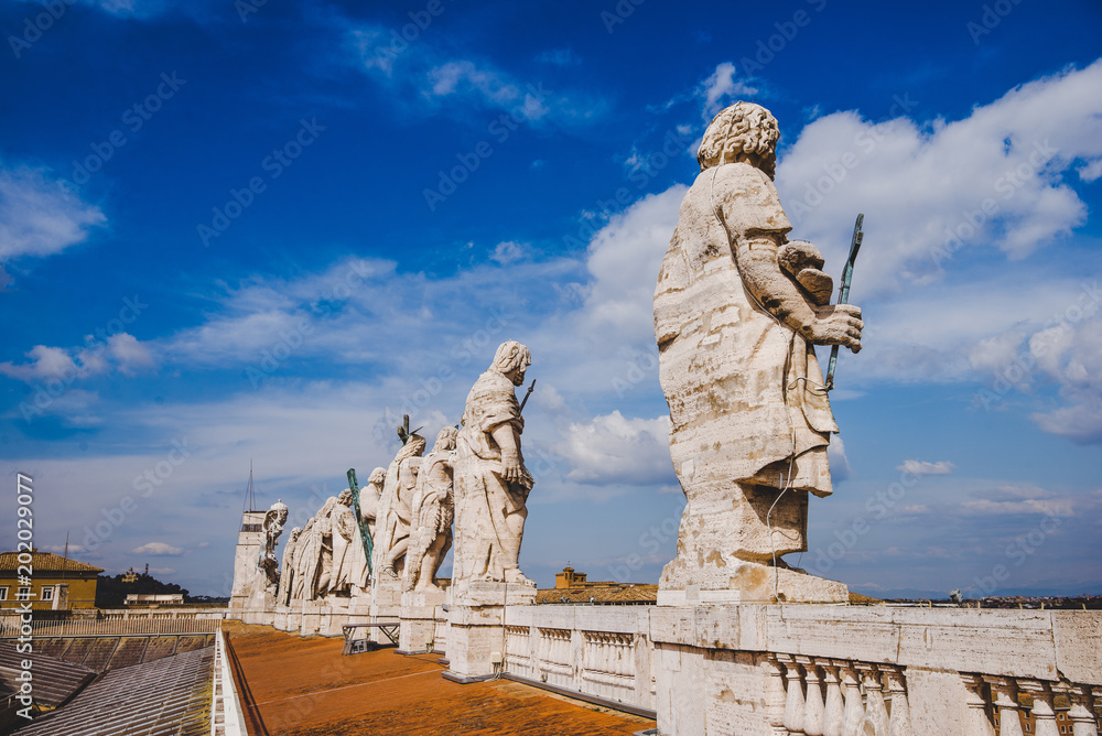 statues on top of St Peters Basilica, Vatican city, Italy