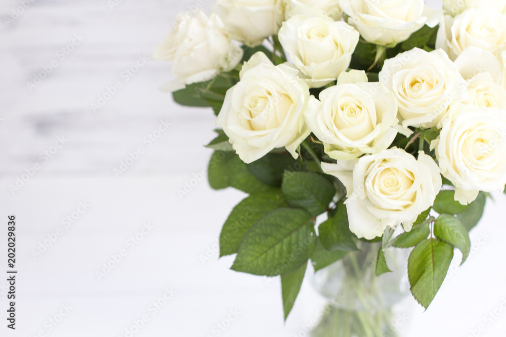 Bouquet of white roses in a vase. Bouquet of chic white roses