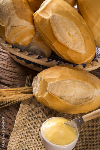Basket of "French bread", traditional Brazilian bread with fire background.