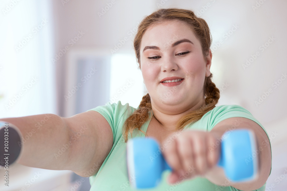 Turquoise shirt. Young red-head woman wearing turquoise shirt while working out Turquoise shirt. Young red-head woman wearing turquoise shirt while working out
