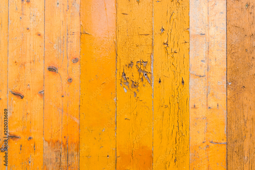 The boards are painted in yellow and a little with peeling paint The boards are painted in yellow and a little with peeling paint