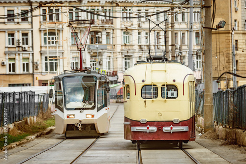 Vintage and modern trams on the town street.