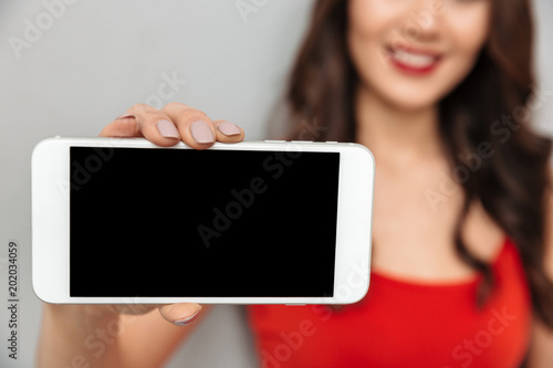 Cropped image of Smiling brunette woman in casual clothes