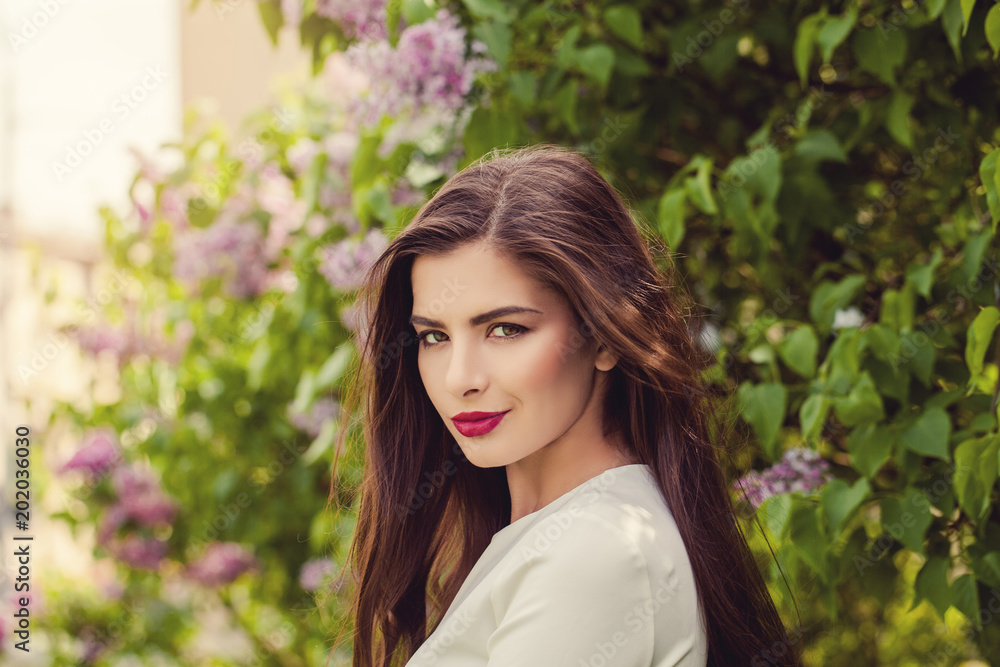 Fototapeta premium Outdoors Portrait of Perfect Young Woman on Floral Background