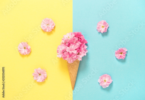 Cherry blossom ice cream waffle Pink flowers Floral flat lay