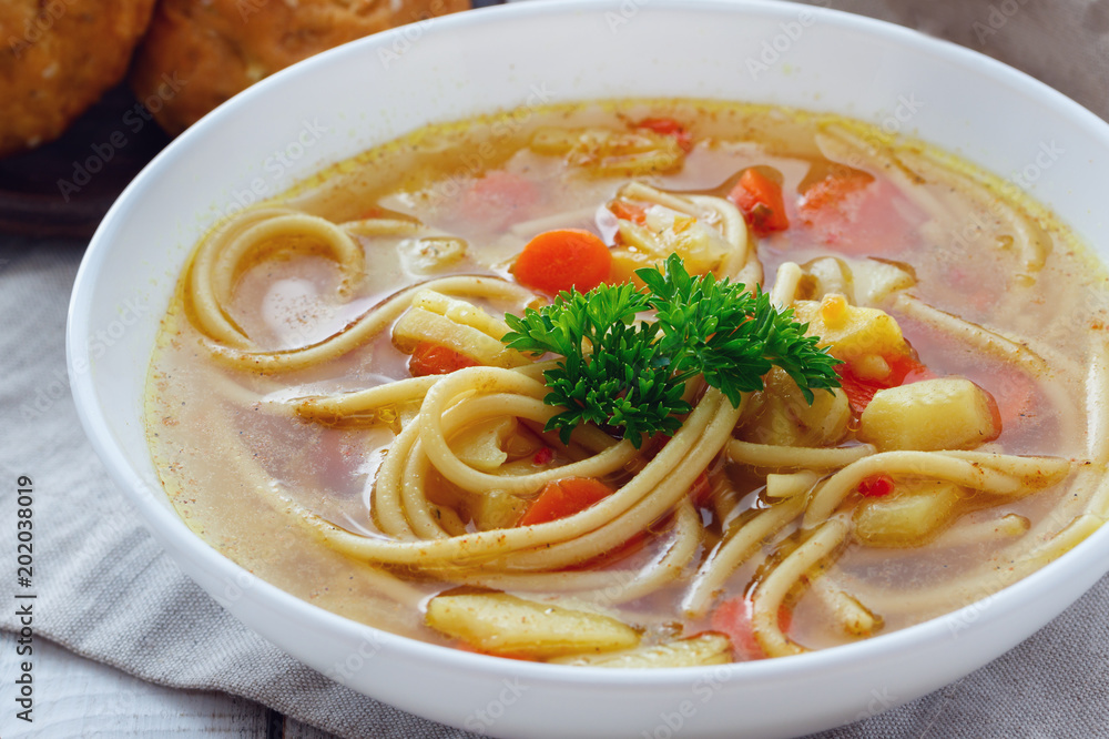 Fresh homemade soup with pasta noodles and vegetables. Vegan dish Fresh homemade soup with pasta noodles and vegetables. Vegan dish