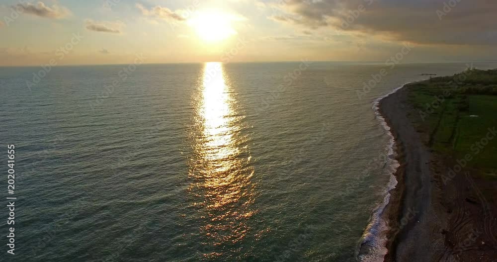 aerial survey of the coastline during the sunset . aerial survey of the coastline during the sunset .