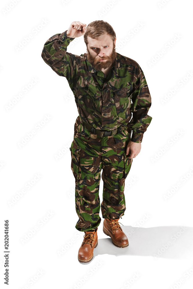 Young army soldier wearing camouflage uniform isolated on white Young army soldier wearing camouflage uniform isolated on white