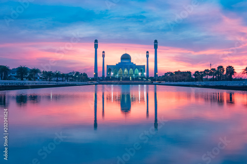 beautiful reflection mosque building shot during sunset or sunrise  photo