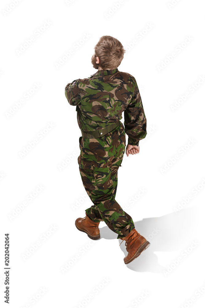 Young army soldier wearing camouflage uniform isolated on white Young army soldier wearing camouflage uniform isolated on white