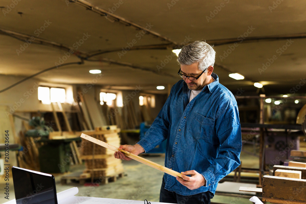 Carpenter taking measures Carpenter taking measures