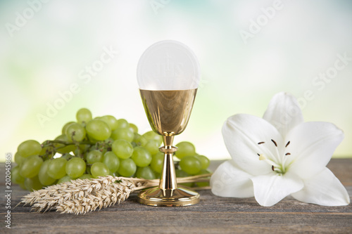 Eucharist symbol of bread and wine, chalice and host, First communion background