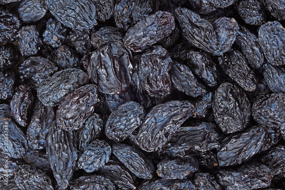Black raisins background Black raisins background