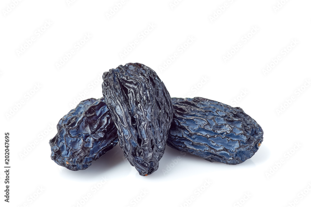Three black raisins on white Three black raisins on white