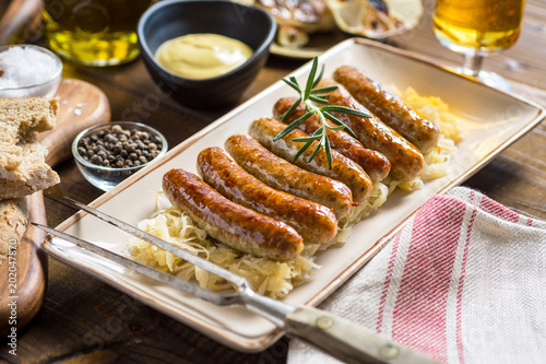 Bilde på lerret Grilled Sausages with Cabbage Salad, Mustard and Beer
