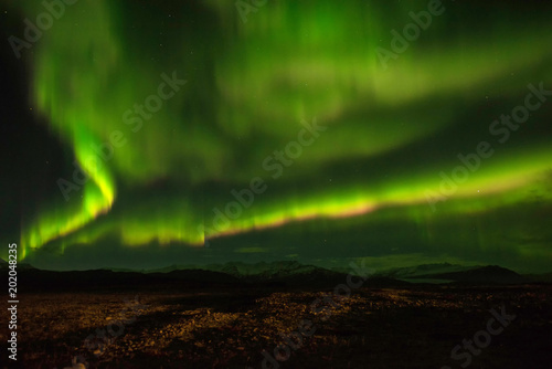 A wonderful night with Kp 5 . Northern lights mountain in Iceland. © MAGNIFIER