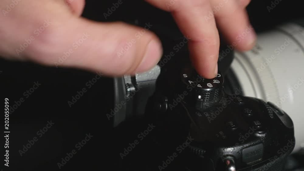 turning the settings wheel on photo camera turning the settings wheel on photo camera