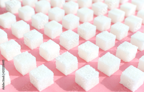 Obraz na płótnie Refined sugar on pink background