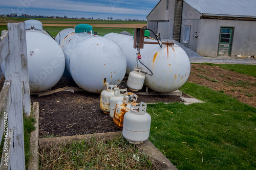 View of propane tanks outside of amish family home used as alternative power source to electricity in a farmland in Lancaster, USA photo