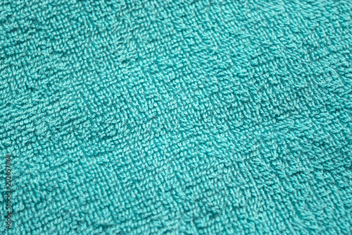 Teal towel background, texture of cotton fibers of bath towel close up