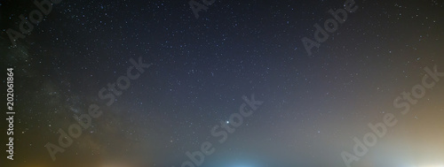 Night sky with a bright star of the Milky Way. Panoramic view of the starry space.