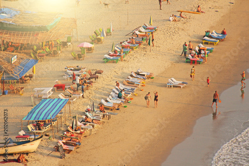 Arambol Beach. View from the sky, from  above, aerophoto, point of view. View of the beach. Long beautiful beach, top view. People walk on the beach, relax on the beach photo